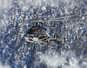 An Airbus H155 hovers among the French Alps. Romain Baheu Photo