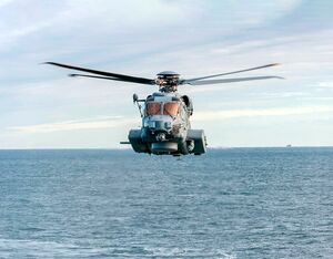 An RCAF CH-148 Cyclone helicopter over water. Cpl Jessica Fox/12 Wing Imaging Services Photo