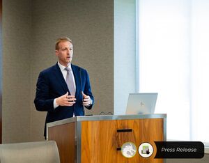 Michael Robbins delivers remarks at AUVSI Defense, September 2023. AUVSI Photo