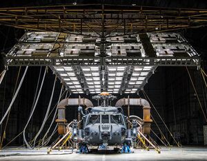 An HH-60W Jolly Green II sits under bright lights used to create heat in the McKinley Climatic Lab on March 19 at Eglin Air Force Base, Florida. The aircraft was tested in temperatures as high as 120 F. USAF/Samuel King Jr. Photo