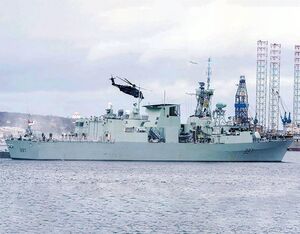 HMCS Fredericton sails away from Halifax along with its embarked CH-148 Cyclone helicopter on Jan. 20. Royal Canadian Navy Photo