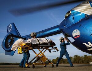 Boston MedFlight paramedics load a patient into an Airbus H145. Boston MedFlight Photo