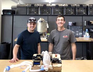 Billings Flying Service engineers Mikale Lynch (left) and Tom Decker (right) stand behind the company’s prototype ventilator. Billings Flying Service Photo