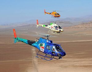 Three Ecocopter Airbus AS350 AStars fly over the Peruvian desert during the 2019 edition of the Dakar Rally. Anthony Pecchi Photo