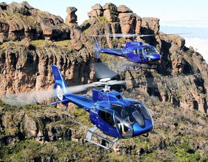 Tropic Air’s Airbus H130 and H125 take flight near the operator’s facility in central Kenya. Anthony Pecchi Photo