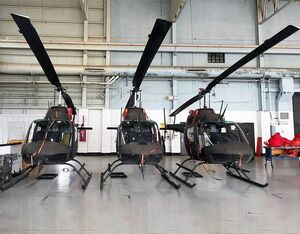 Three OH-58 Kiowa helicopters stand ready to bid farewell to active service on July 9. DVIDS Photo