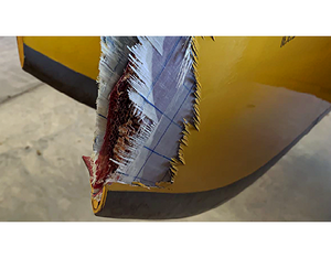 One of the AW139’s blades sustained significant damage to its tip cap, while two other blades showed evidence of damage to the abrasion strip on the outer most edge of the tip cap. ATSB Photo
